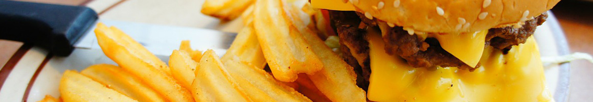 Eating Burger Cheesesteak at Tornado Burger restaurant in Stafford, TX.